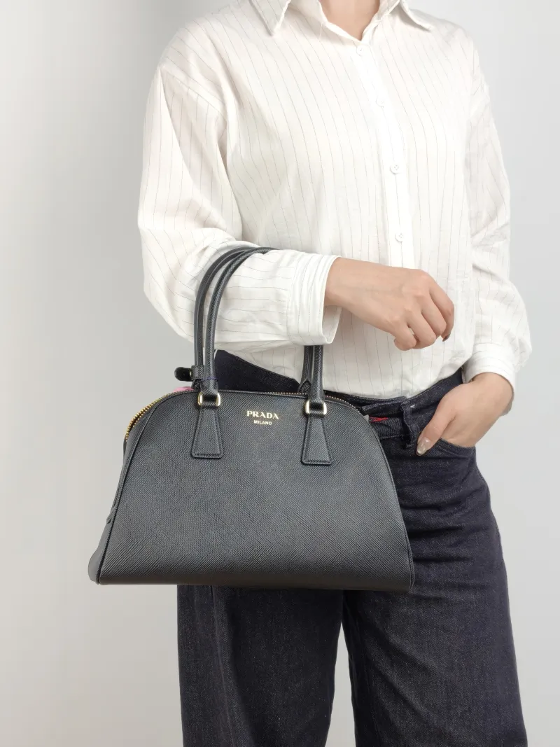 PRADA Top Handle Bag Saffiano Black Calfskin One Size 31.5 × 11 × 20 cm — on-model view 2 of 2