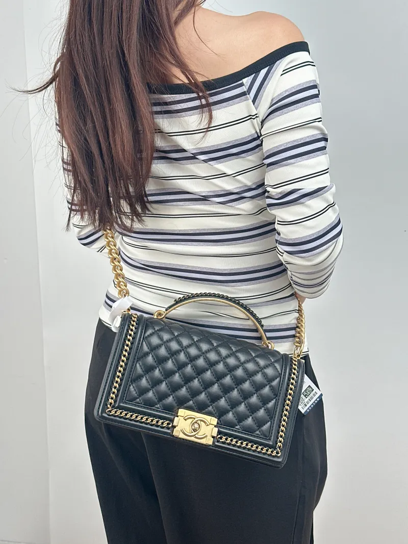 Chanel Crossbody Bag le boy Black Calfskin Medium 25 × 9 × 15 cm — on-model view 2 of 2