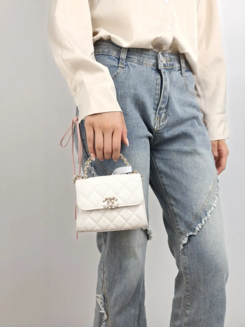 Chanel Crossbody Bag kelly White Gold Grained Calfskin nano 15 × 5 × 11 cm — on-model view 2 of 2