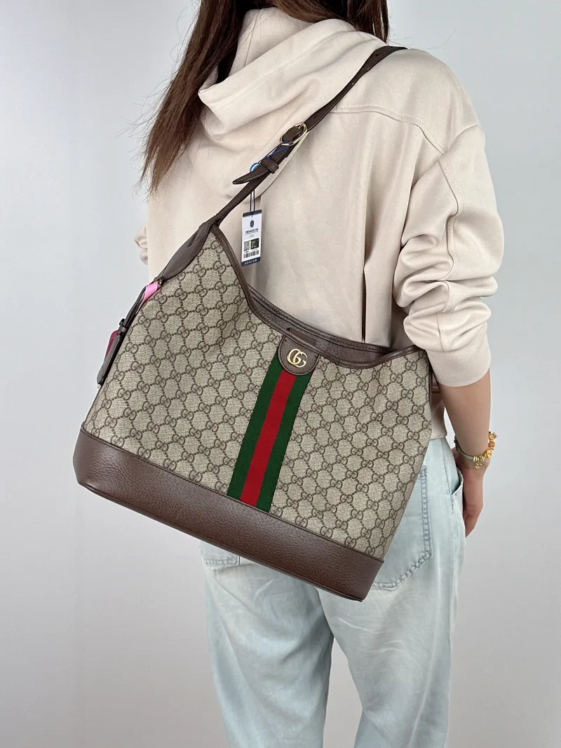 GUCCI Crossbody Bag ophidia Bucket Bag Monogram PVC One Size 34 × 16 × 31 cm — on-model view 1 of 2