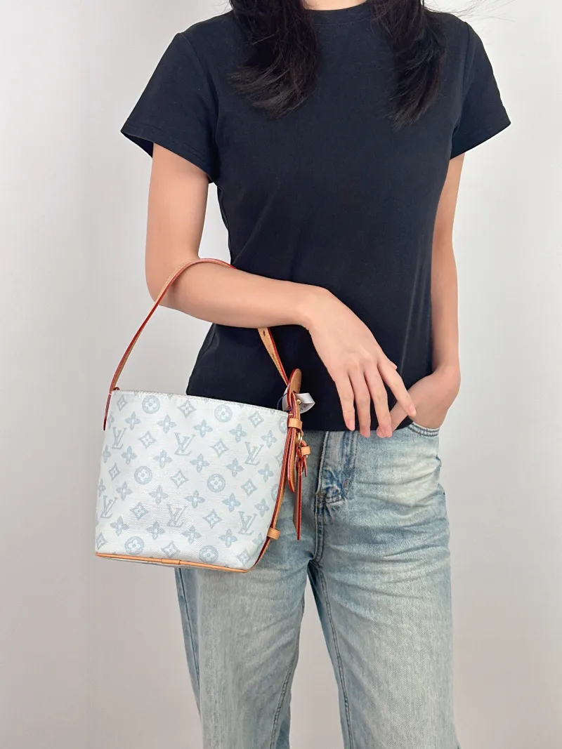 Louis Vuitton Top Handle Bag ALL IN BB Blue PVC BB 16 × 12 × 18 cm — on-model view 2 of 3