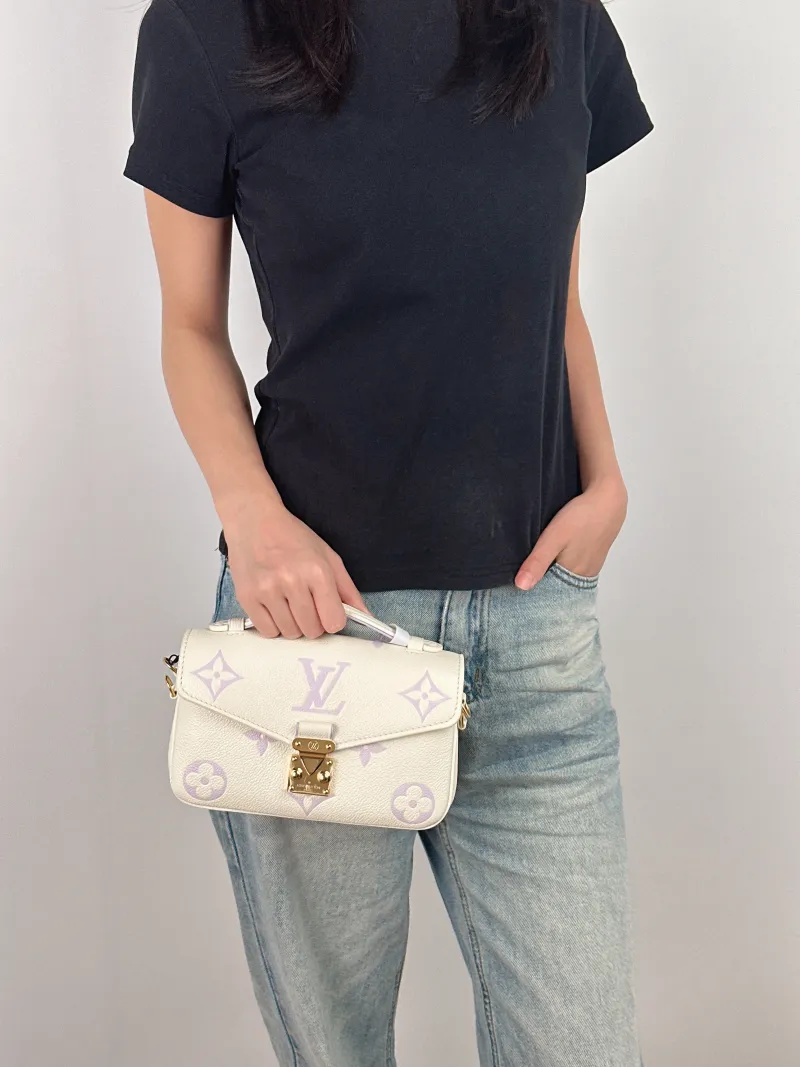 Louis Vuitton Crossbody Bag Pochette Métis East West White · Monogram Empreinte Embossed Calfskin Small 21.5 × 6 × 13.5 cm — on-model view 3 of 4