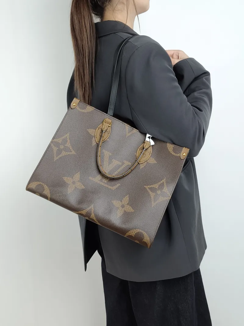 Louis Vuitton Shoulder Bag Onthego Medium Monogram PVC Medium 35 × 14 × 27 cm — on-model view 3 of 3