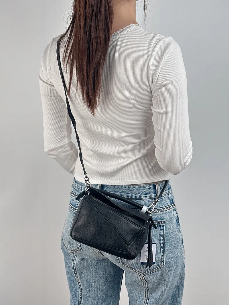 LOEWE Crossbody Bag Puzzle Black CC alfskin Mini 18 × 8 × 12.5 cm — on-model view 1 of 2