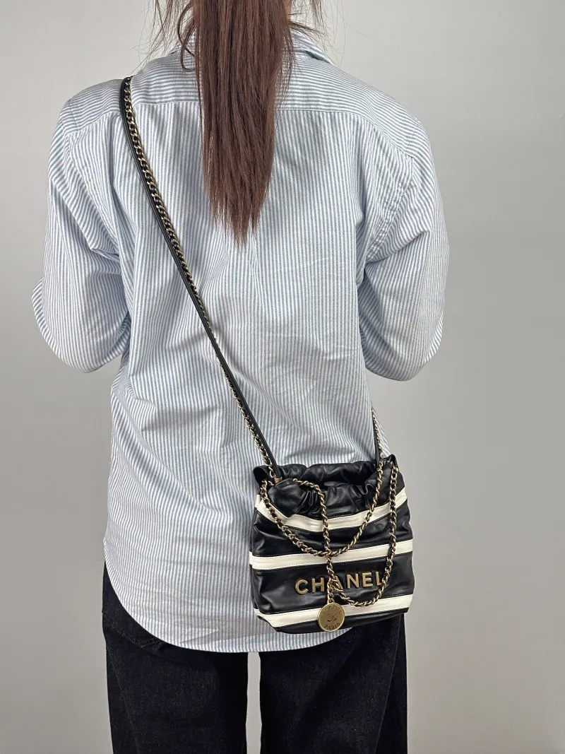 Chanel Crossbody Bag22Bag Black White Calfskinmini20 × 6 × 19 cm — on-model view 1 of 2