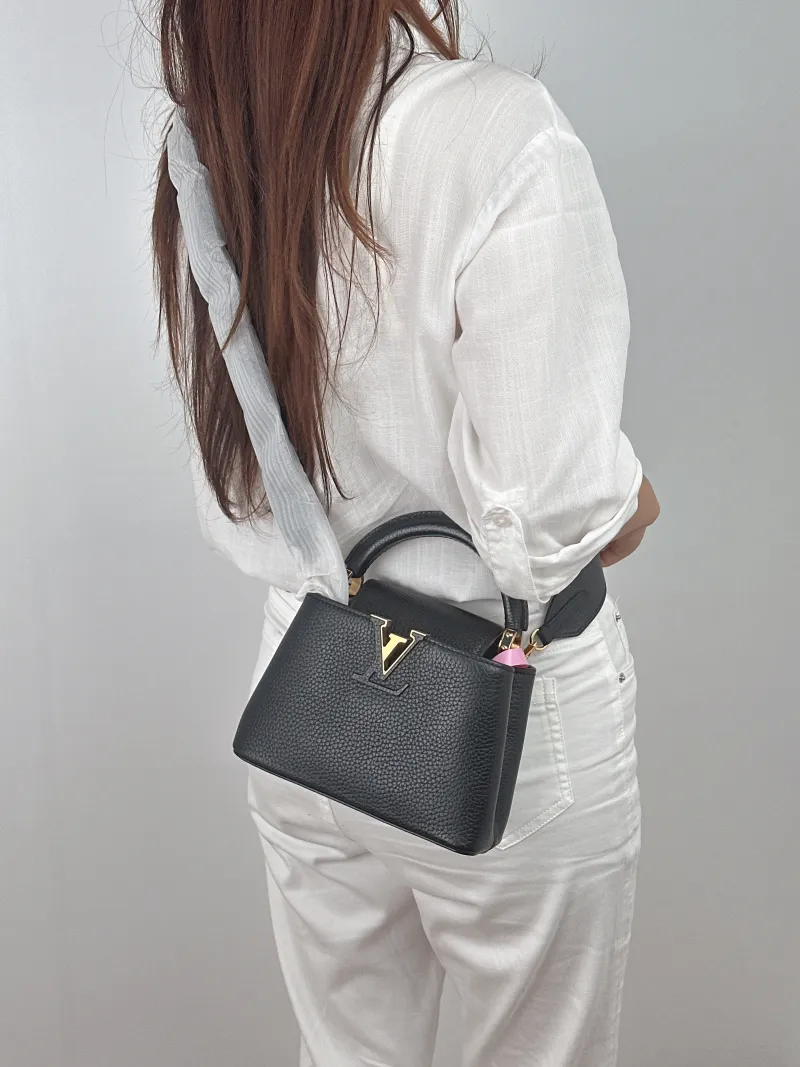 Louis Vuitton Crossbody Bag Capucines Black Calfskin Mini 21 × 8 × 14 cm — on-model view 2 of 2