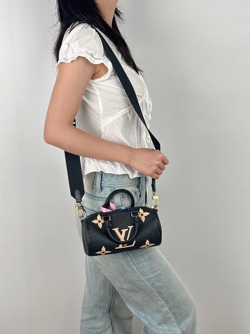 Louis Vuitton Crossbody Bag Papillon Black · White Monogram Empreinte Embossed Calfskin BB 20 × 10 × 10 cm — on-model view 3 of 3