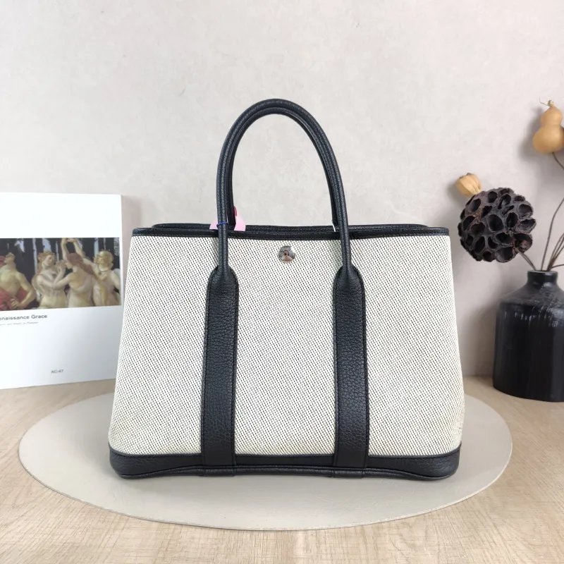 Hermès Top Handle Bag Garden Party 30 30 Beige · Black Canvas · Negonda Calfskin Medium 30 × 13 × 21 cm B — cover view 6 of 6