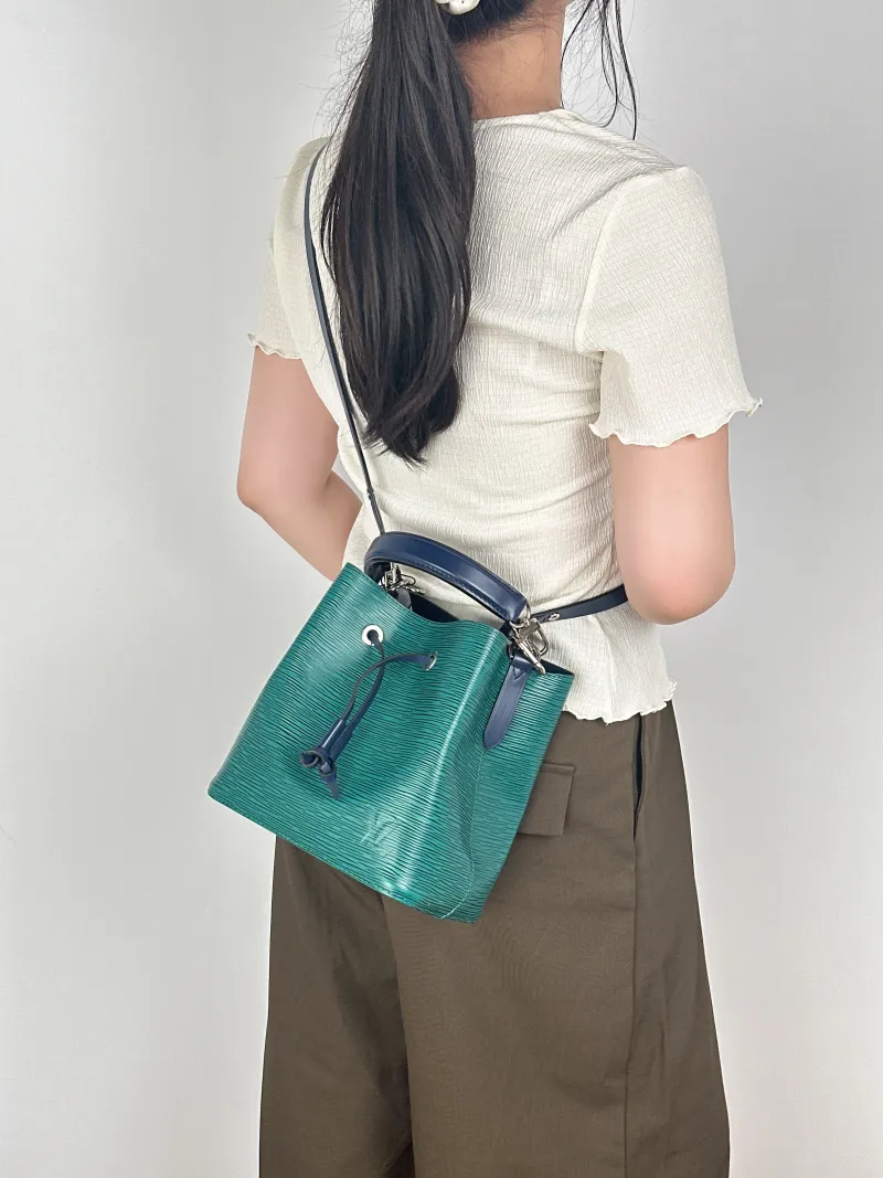 GUCCI Crossbody Bag NÉONOÉ Bucket Bag BB Monogram PVC Medium 24 × 7 × 14.5 cm — on-model view 1 of 3