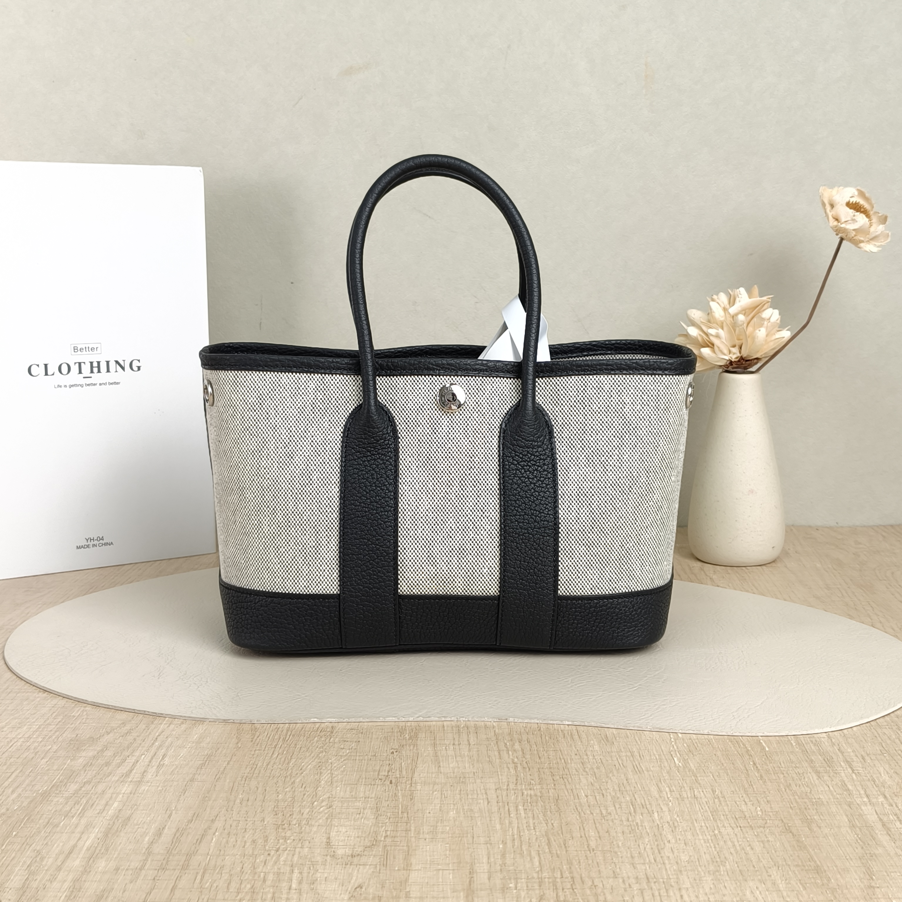 Hermès Top Handle Bag Neo Garden 23 Mini Black · Beige Canvas · Negonda Calfskinmini23 × 10 × 16 cm — cover view 2 of 6