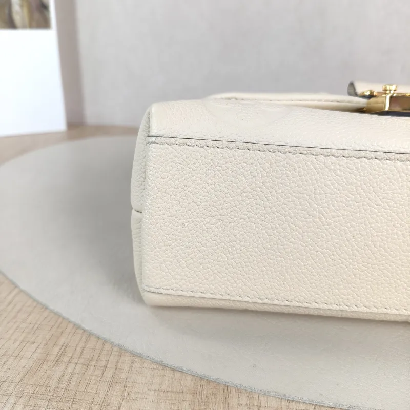 Louis Vuitton Crossbody Bag MADELEINE Beige Monogram Empreinte Embossed Calfskin BB 24 × 8.5 × 17 cm — detail view 6 of 12