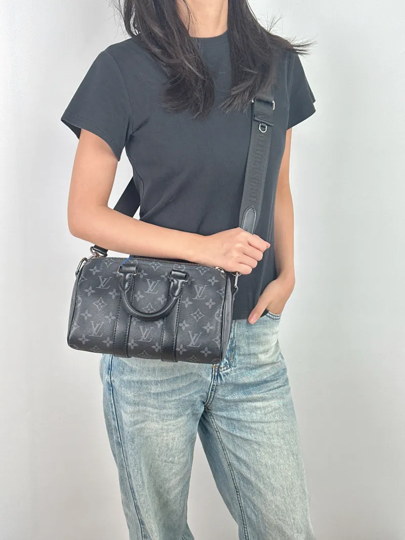 Louis Vuitton Crossbody Bag Keepall 25 PVC Medium 25 × 11 × 15 cm — on-model view 1 of 3