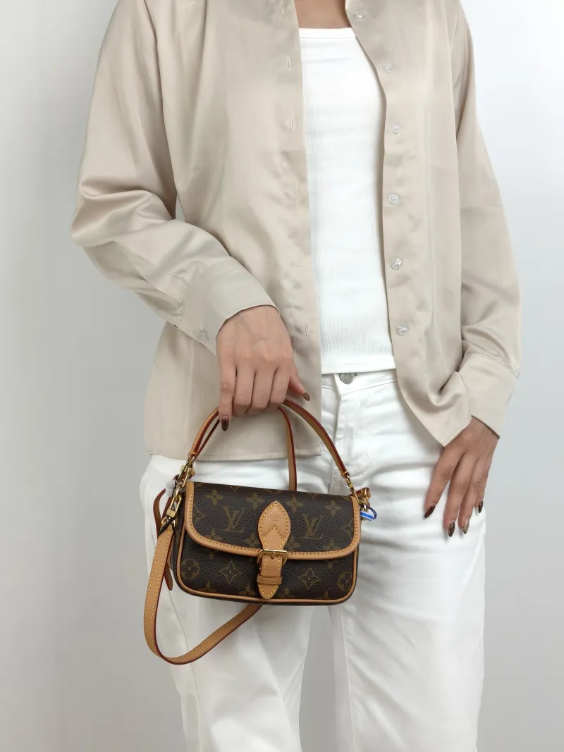 Louis Vuitton Crossbody Bag Diane Baguette Bag Monogram PVC nano 19 × 6 × 10.5 cm — on-model view 1 of 3