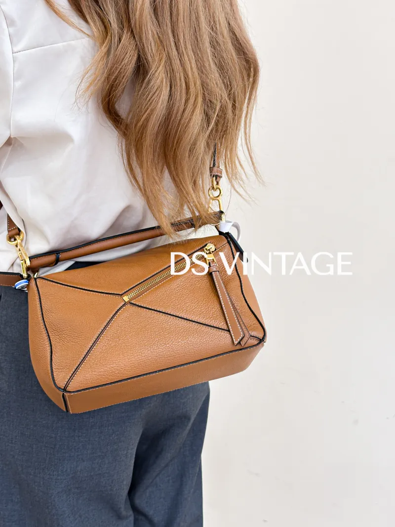 LOEWE Crossbody Bag Puzzle Caramel CC alfskin Small 24 × 10.5 × 16.5 cm — on-model view 1 of 4