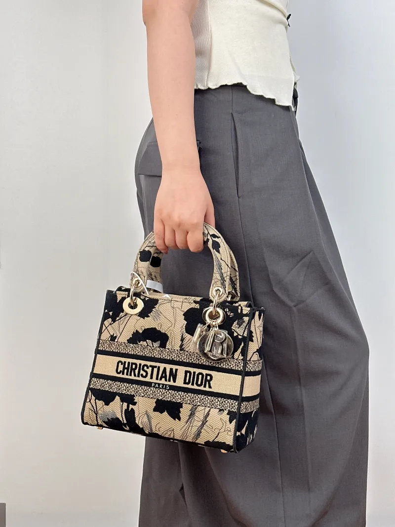 DIOR Top Handle Bag Lady Lady Dior Bag Beige Black Canvas Medium24 × 12 × 21 cm — on-model view 1 of 3