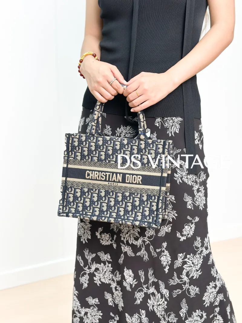 DIOR Top Handle Bag Book Tote Blue Canvas Small 26.5 × 14 × 22 cm — on-model view 1 of 3
