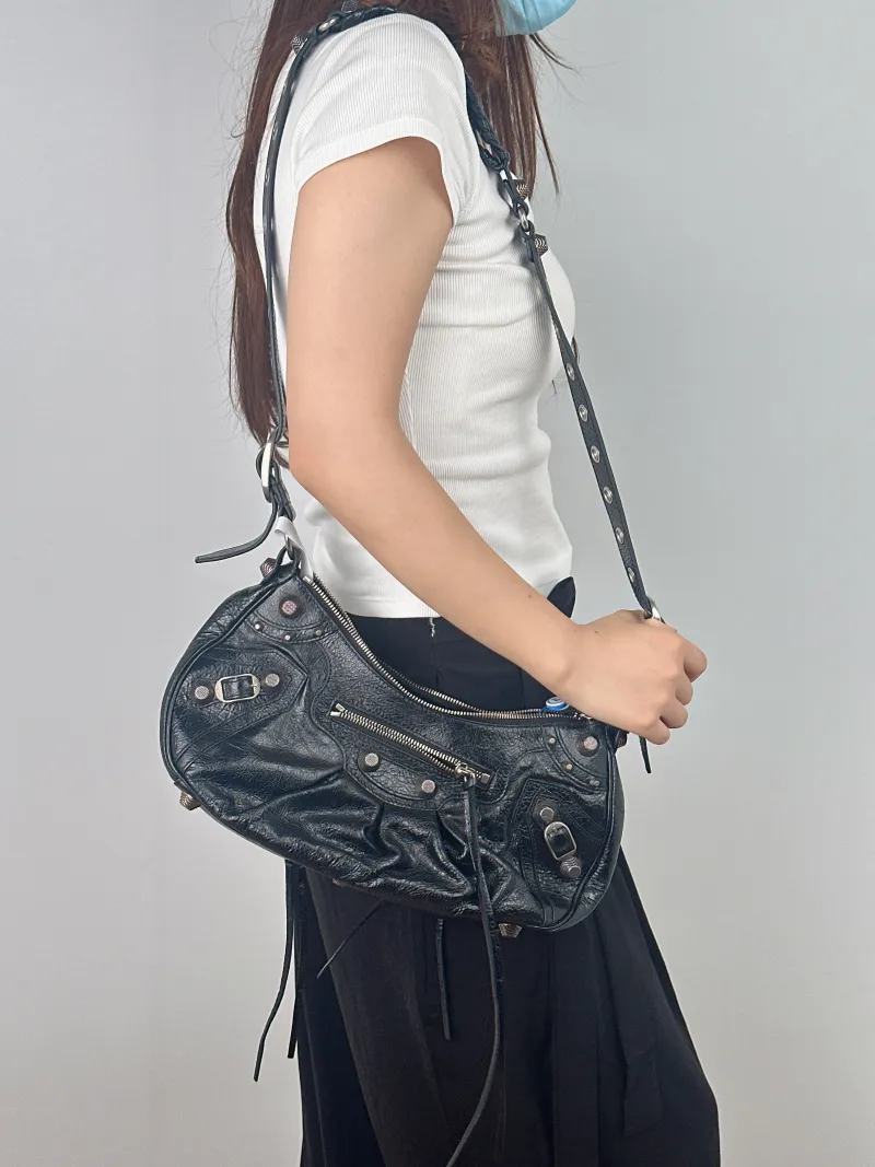 BALENCIAGA Crossbody Bag LE CAGOLE Black Lambskin Small 33 × 8.5 × 16 cm — on-model view 1 of 2