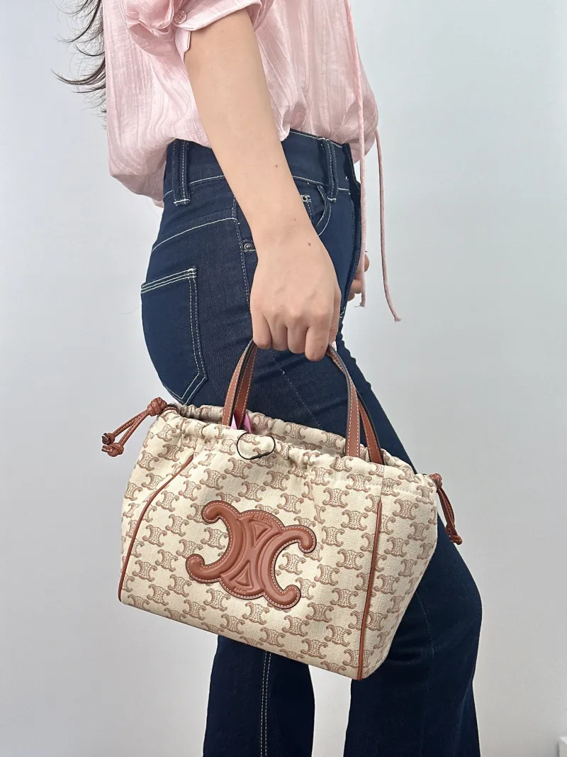 CELINE Top Handle Bag CABAS TRIOMPHE White PVC Small 22 × 15 × 17 cm — on-model view 1 of 2