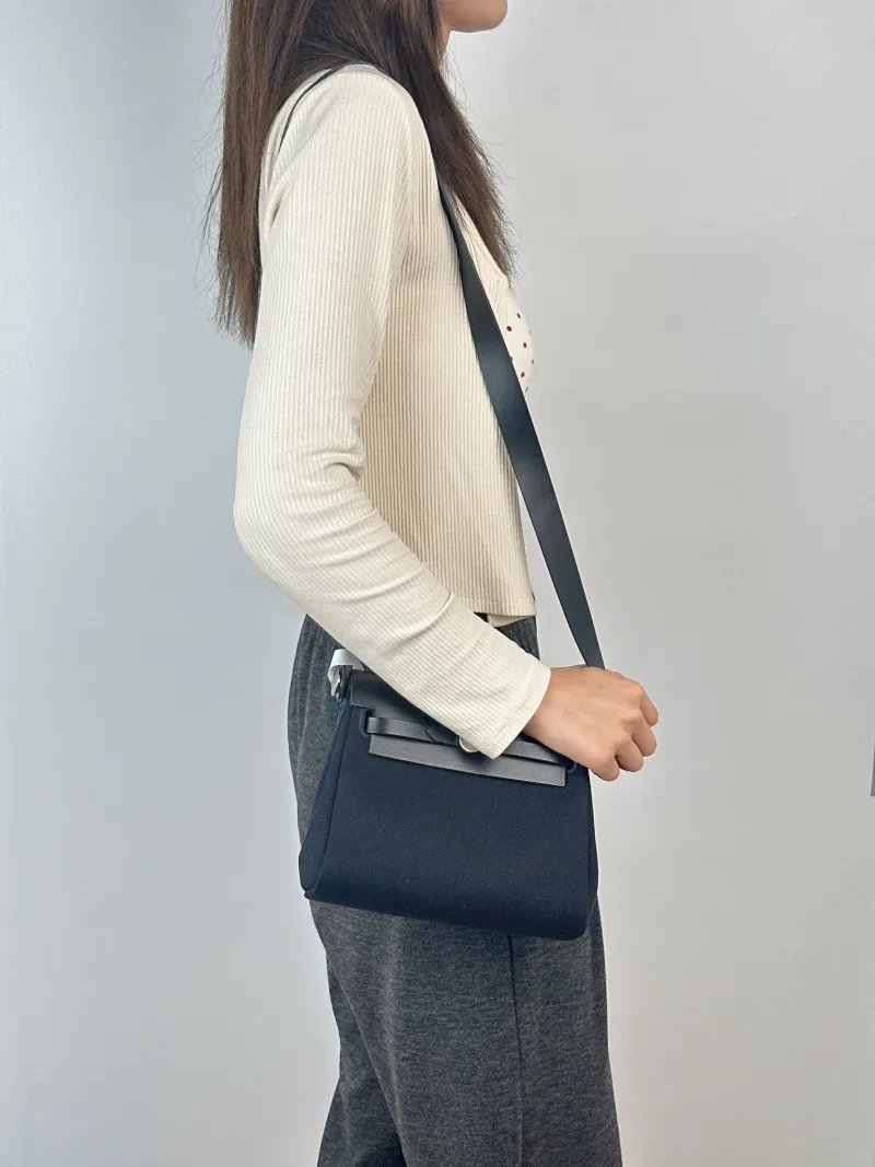 Hermès Crossbody Bag Herbag Zip 20Black Calfskin，Canvasmini20.5 × 7 × 16.5 cm — on-model view 2 of 2