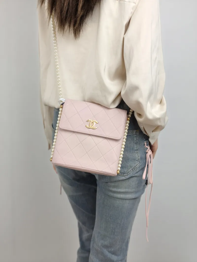 Chanel Crossbody Bag Pearl Crossbody Bag Pink Calfskin One Size 19 × 8 × 19 cm 31 — on-model view 1 of 2