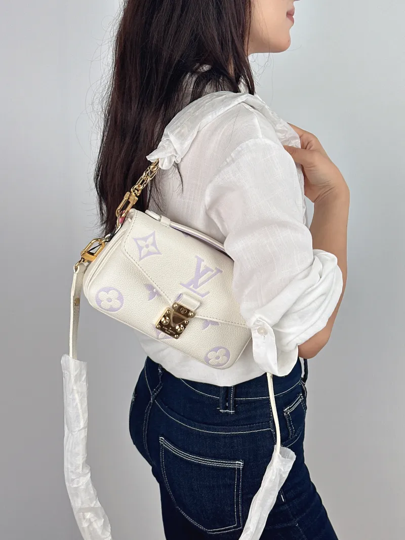 Louis Vuitton Crossbody Bag Pochette Métis East West White · Empreinte Embossed Calfskin Small 21.5 × 6 × 13.5 cm — on-model view 1 of 3