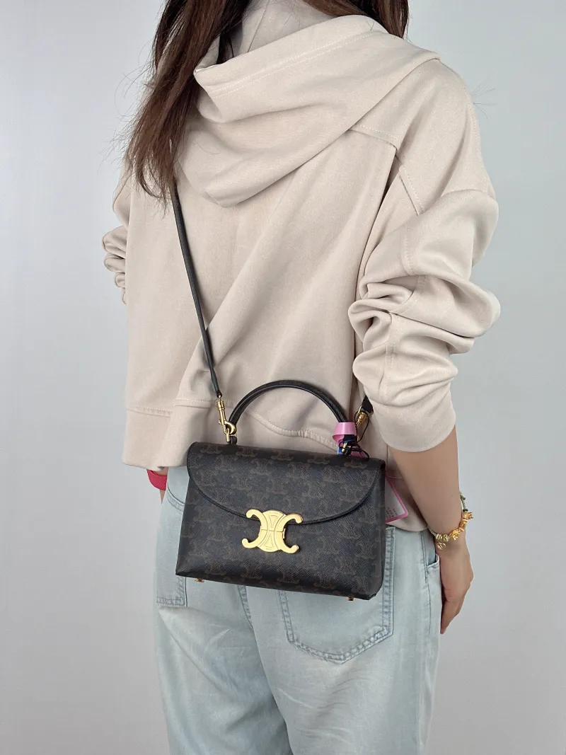 CELINE Top Handle Bag TEEN NINO Top Handle Bag Monogram PVC Small 20 × 8 × 13 cm — on-model view 1 of 2