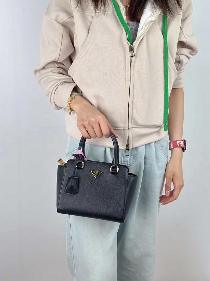 PRADA Top Handle Bag Tote Bag Black Calfskin Mini 18 × 9 × 15 cm — on-model view 2 of 2