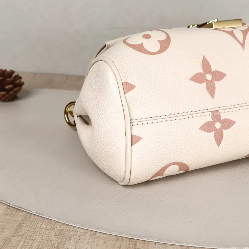 Louis Vuitton Crossbody Bag Favorite White · Pink Empreinte Embossed Calfskin Monogram Medium24 × 9 × 14 cm — detail view 14 of 14