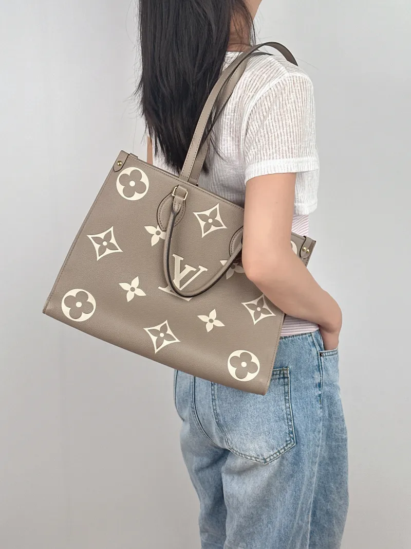 Louis Vuitton Shoulder Bag Onthego Medium · White Empreinte Embossed Calfskin Medium35 × 14 × 27 cm — on-model view 2 of 2