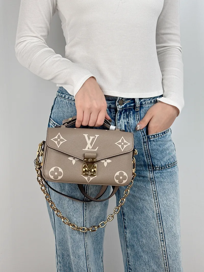 Louis Vuitton Crossbody Bag Pochette Métis East West Monogram Empreinte Embossed Calfskin Small 21.5 × 6 × 13.5 cm — on-model view 3 of 3