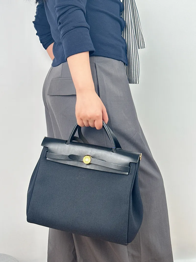 Hermès Crossbody Bag Herbag 31 Black Canvas Medium 30.5 × 11 × 25.5 cm Y — on-model view 2 of 2