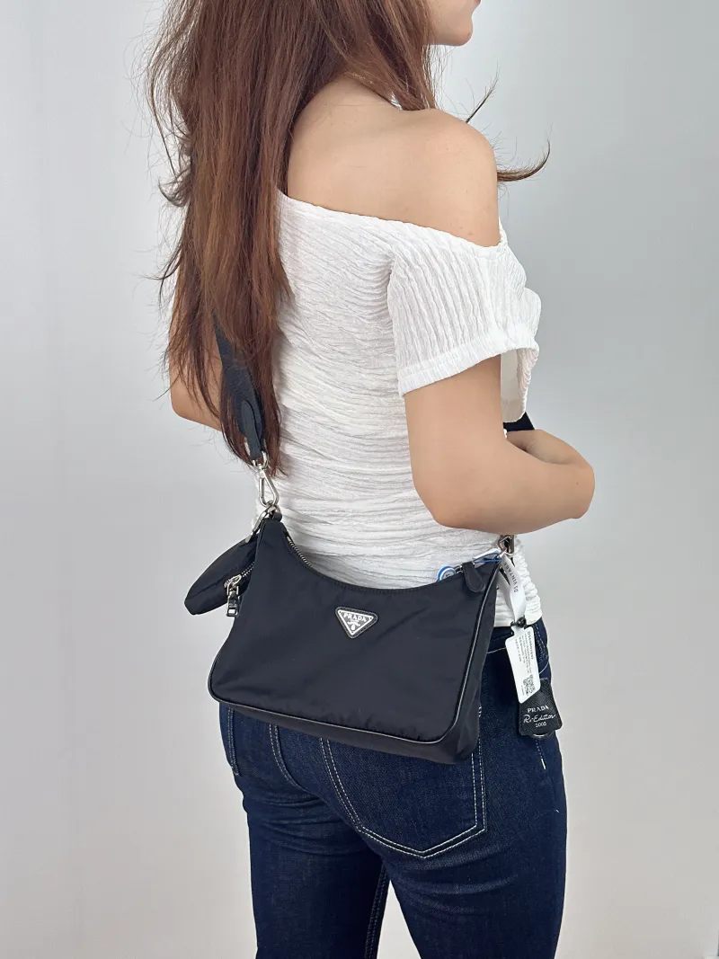 PRADA Shoulder Bag Re-Edition hobo — on-model view 2 of 2