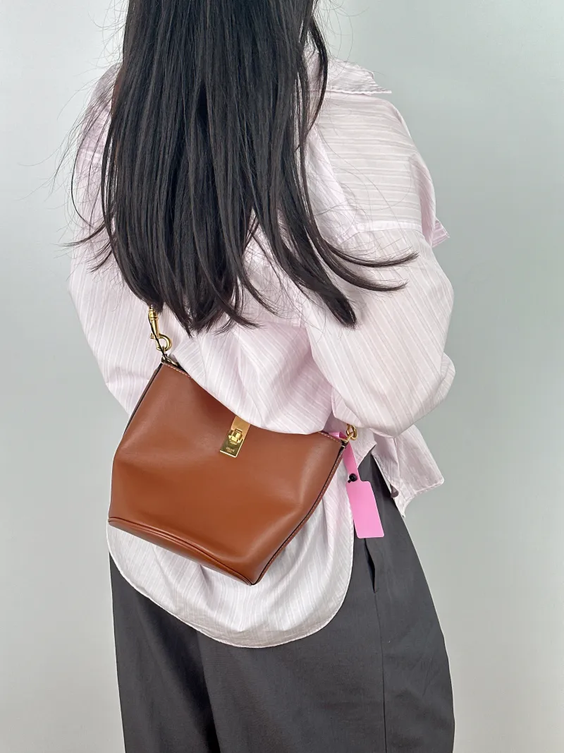 CELINE Crossbody Bag Bucket 16 Bucket Bag Caramel Calfskin Small 16 × 16 × 18 cm — on-model view 2 of 2