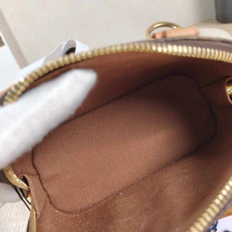 Louis Vuitton Crossbody Bag Alma Nano Monogram PVC nano 18 × 8 × 12 cm — detail view 5 of 12