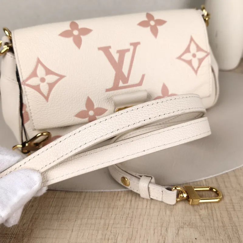 Louis Vuitton Crossbody Bag Favorite White · Pink Empreinte Embossed Calfskin Monogram Medium24 × 9 × 14 cm — detail view 8 of 14