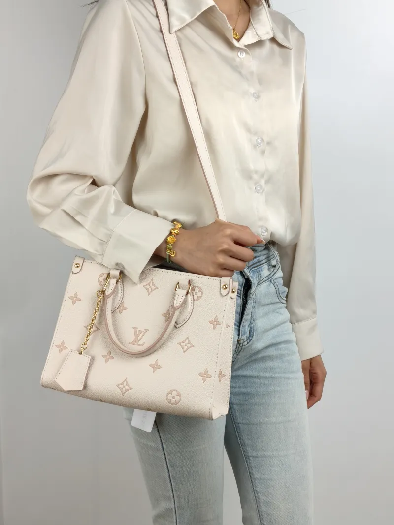 Louis Vuitton Shoulder Bag Onthego Beige · Pink Empreinte Embossed Calfskin Small 25 × 11.5 × 19 cm — on-model view 3 of 3