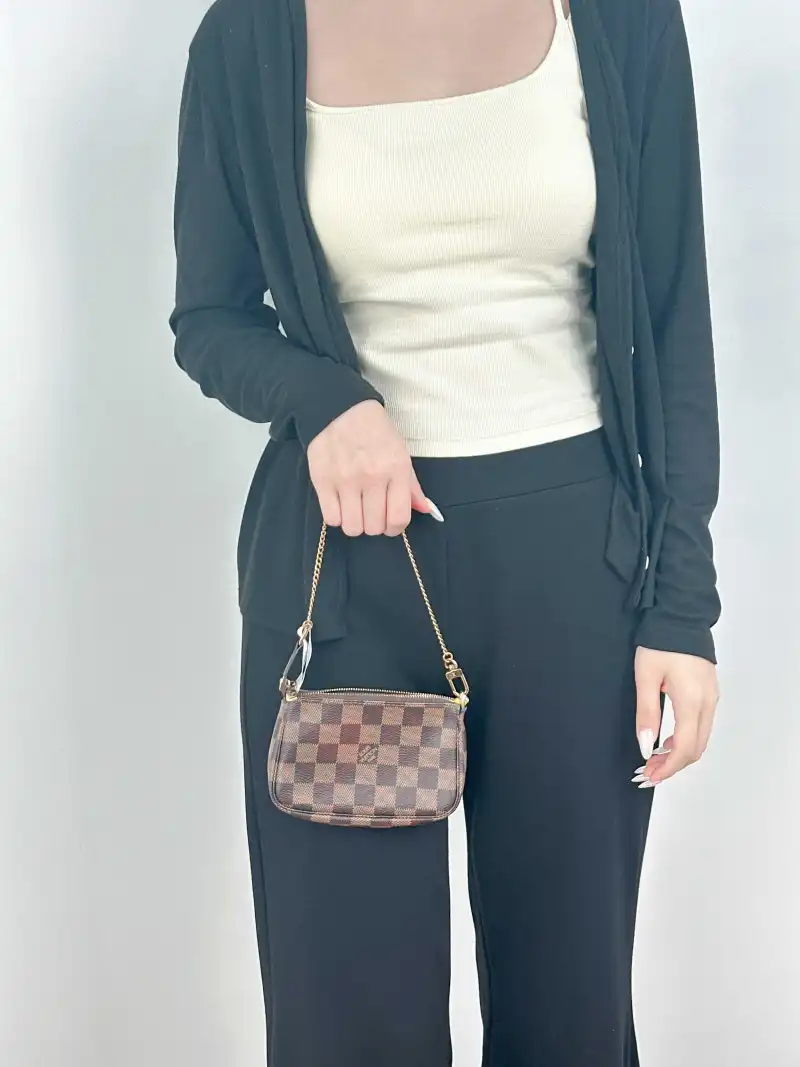Louis Vuitton Clutch Mini Pochette Accessoires PV Cmini15.5 × 4 × 10.5 cm — on-model view 1 of 1