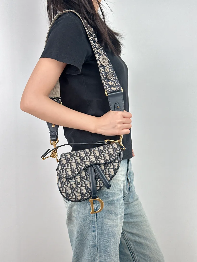 DIOR Top Handle Bag Saddle Blue Canvas Mini 19 × 6 × 15 cm — on-model view 1 of 3