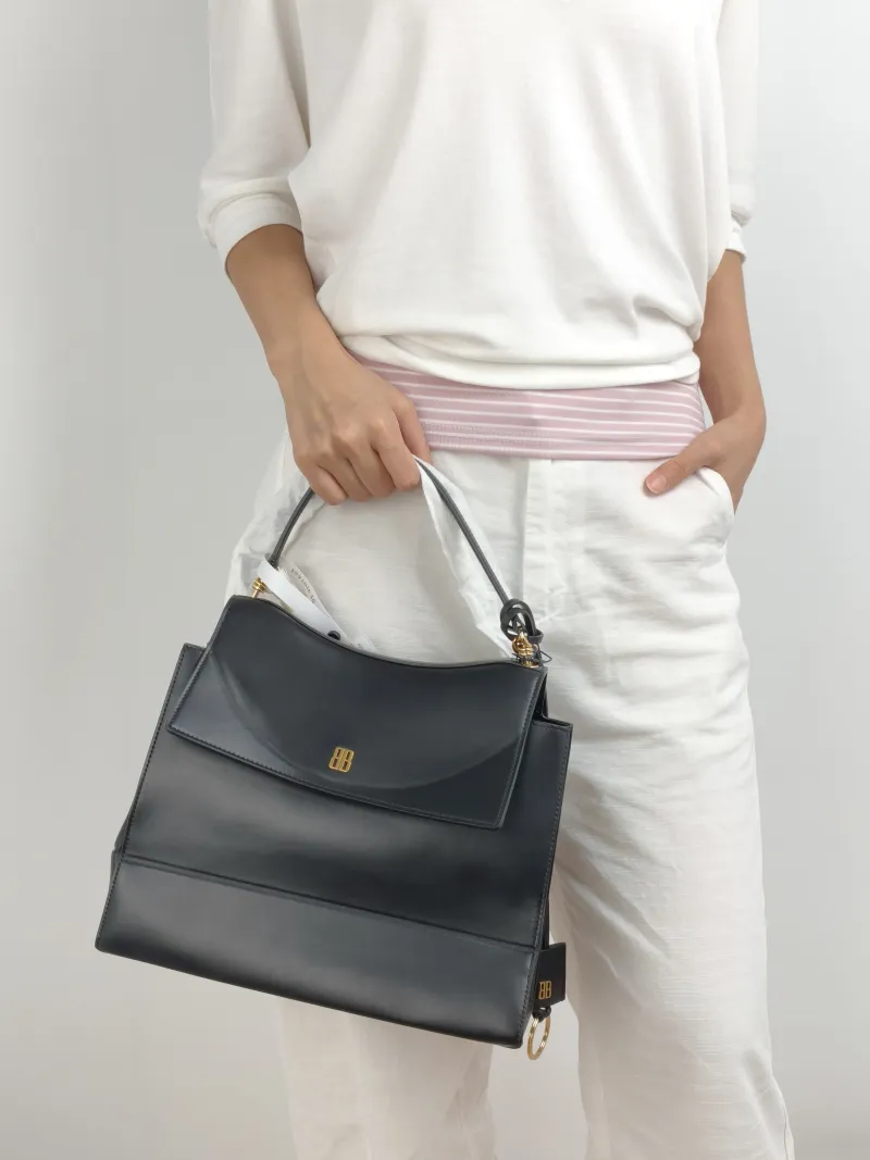 BALENCIAGA Crossbody Bag Top Handle Crossbody Bag Black Calfskin One Size 28 × 12 × 23 cm — on-model view 2 of 2