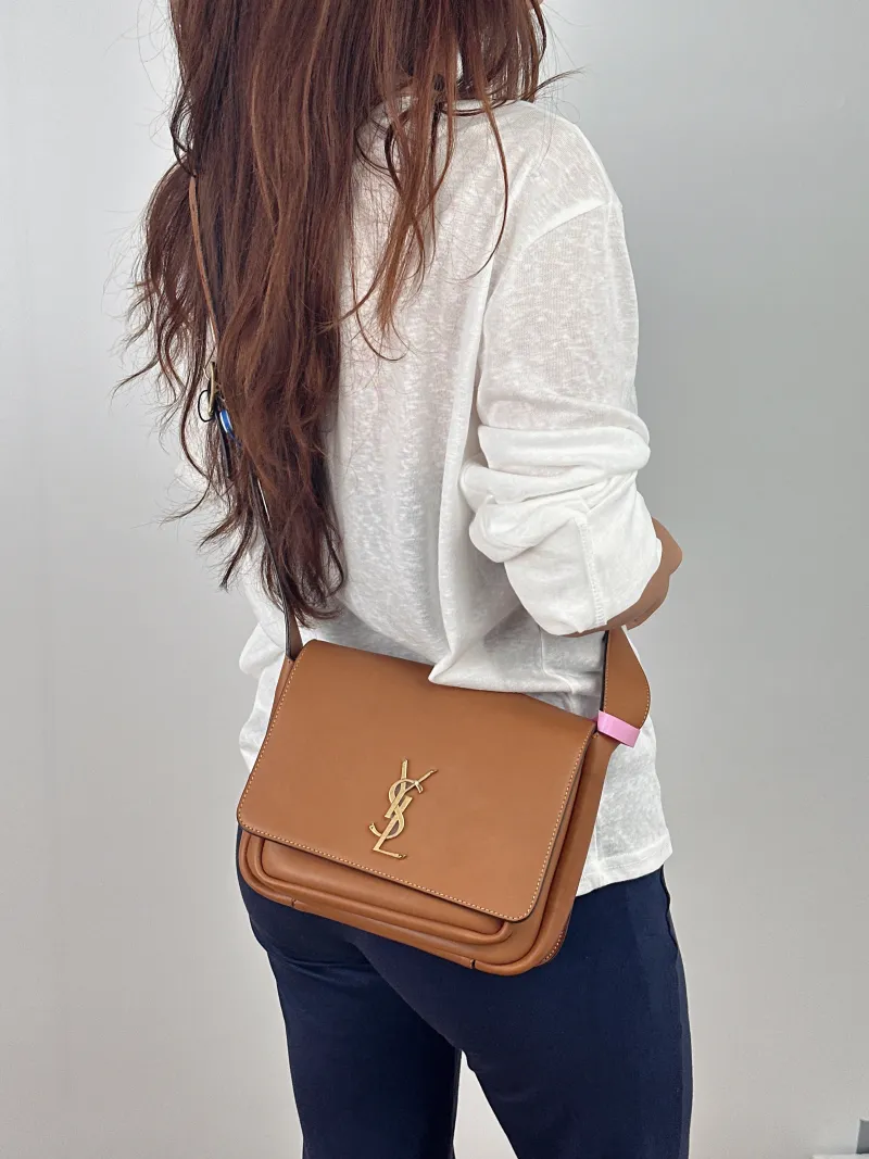 SAINT LAURENT Crossbody Bag Niki Besace Messenger Bag Caramel Calfskin Small 21.5 × 9.5 × 16 cm — on-model view 2 of 2