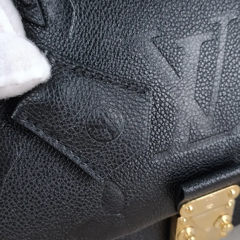 Louis Vuitton Crossbody Bag MADELEINE Black Monogram Empreinte Embossed Calfskin Medium 30 × 11 × 19.5 cm — detail view 3 of 11