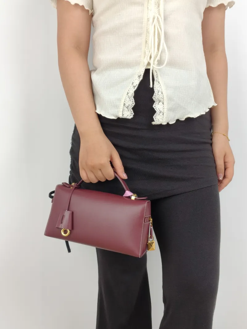 Loro Piana Crossbody Bag Extra Bag L23 Burgundy Calfskin One Size 23 × 7 × 12 cm — on-model view 1 of 3