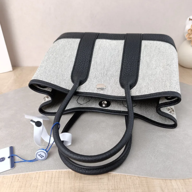 Hermès Top Handle Bag Neo Garden 23 Mini Black · Beige Canvas · Negonda Calfskin Mini 23 × 10 × 16 cm G — detail view 10 of 11