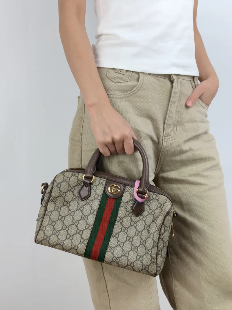 GUCCI Top Handle Bag Ophidia Monogram PVC Medium 25 × 14 × 17 cm — on-model view 3 of 3