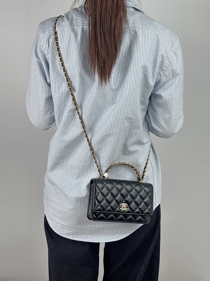 Chanel Crossbody Bag woc Black Lambskin Mini 19.2 × 3.5 × 12.3 cm — on-model view 1 of 3