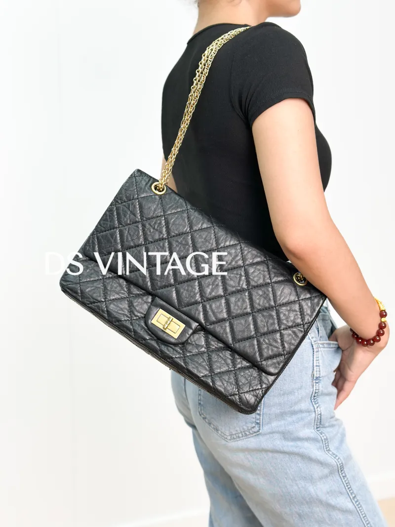 Chanel 2.55 Conditioned Medium Black with Gold-Tone Hardware Calfskin15 · Authenticity Card · 28 × 7.5 × 19.5 cm — on-model view 1 of 3
