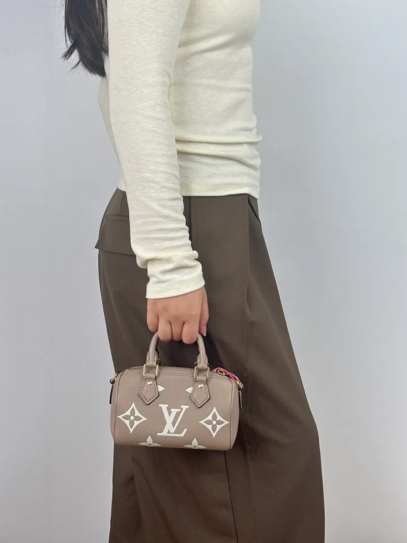 Louis Vuitton Crossbody Bag Speedy Nano · White Empreinte Embossed Calfskin nano 16 × 7.5 × 10 cm — on-model view 2 of 3