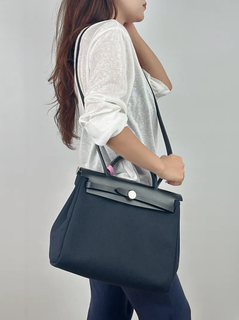 Hermès Shoulder Bag Herbag 31 Black Canvas Medium 31 × 10 × 25 cm z — on-model view 1 of 2