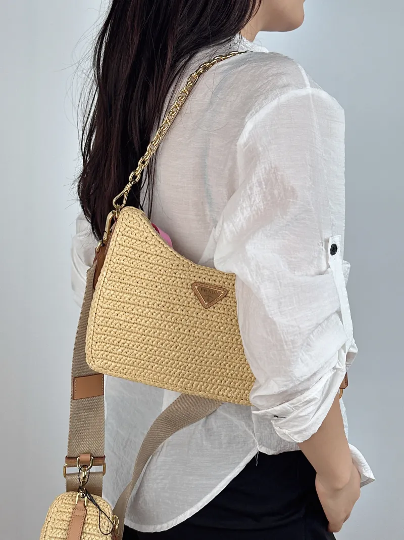 PRADA Crossbody Bag Re-Edition 2005 Hobo Woven Mini 22 × 6 × 18 cm — on-model view 1 of 2