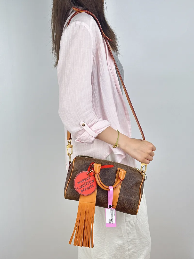 Louis Vuitton Crossbody Bag Keepall 25 Edition Brown PVC Medium25 × 11 × 15 cm — on-model view 1 of 3